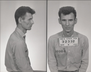 A black & white image of a man in presumably a jail or prison uniform with a sign around his neck that contains the words "Colo State Pen" and the number "32332 and the date "Mar 9, 1960." The left is a half-body profile shot and the right is a half-body forward-facing photo.