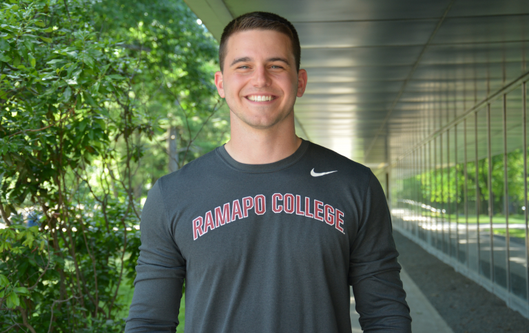 Ramapo alum, Jake Gursaly wearing a Ramapo College shirt