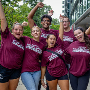 Group of students cheering together during move-in
