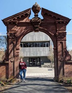 Marissa Krasny student leaning on the Arch